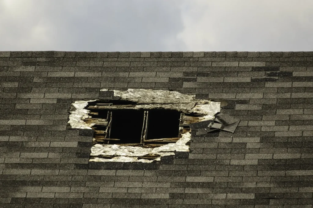 damaged hole on roof of house